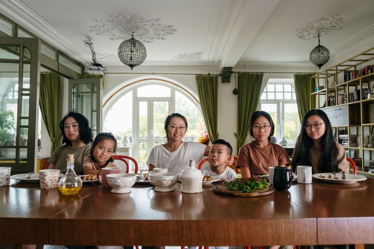 A family dinner table with a home-cooked meal that doesn't match a generic diet-plan photo — real dishware, real portions.
